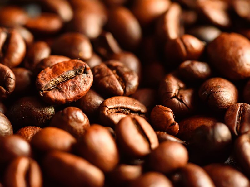 Close-up background of brown roasted coffee beans. Organic concept