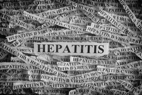 Torn pieces of paper with the words Hepatitis Torn pieces of paper with the words Hepatitis